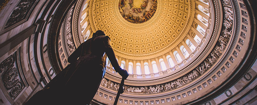 Image of statue inside of court building with golden ceiling Image of statue inside of court building with golden ceiling