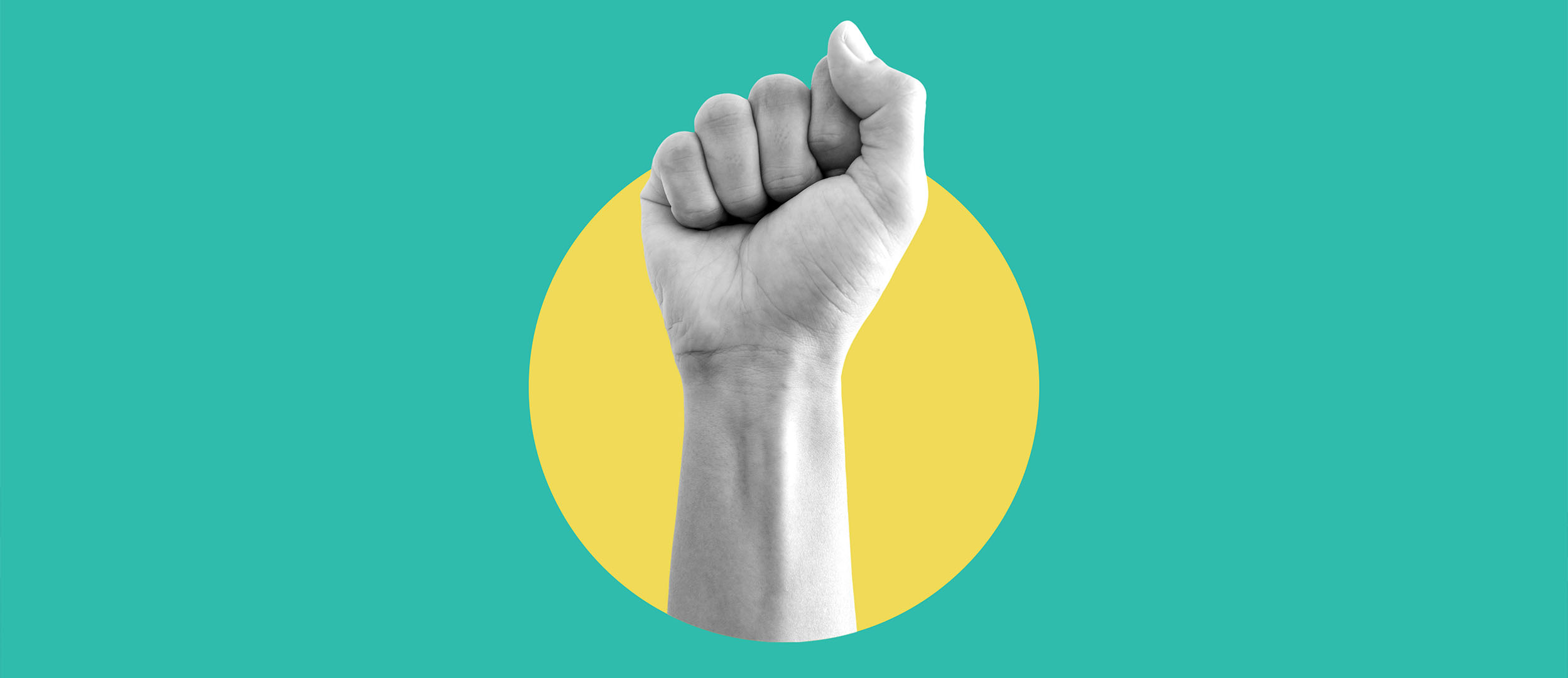 Hand raised in a first in protest Hand raised in a first in protest