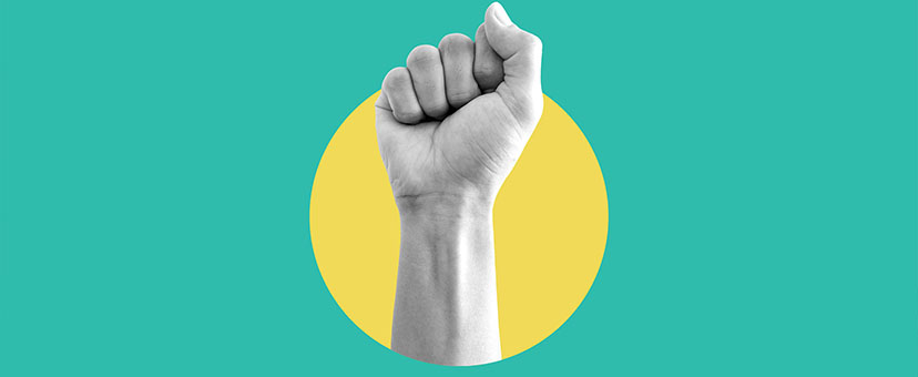 Hand raised in a first in protest Hand raised in a first in protest