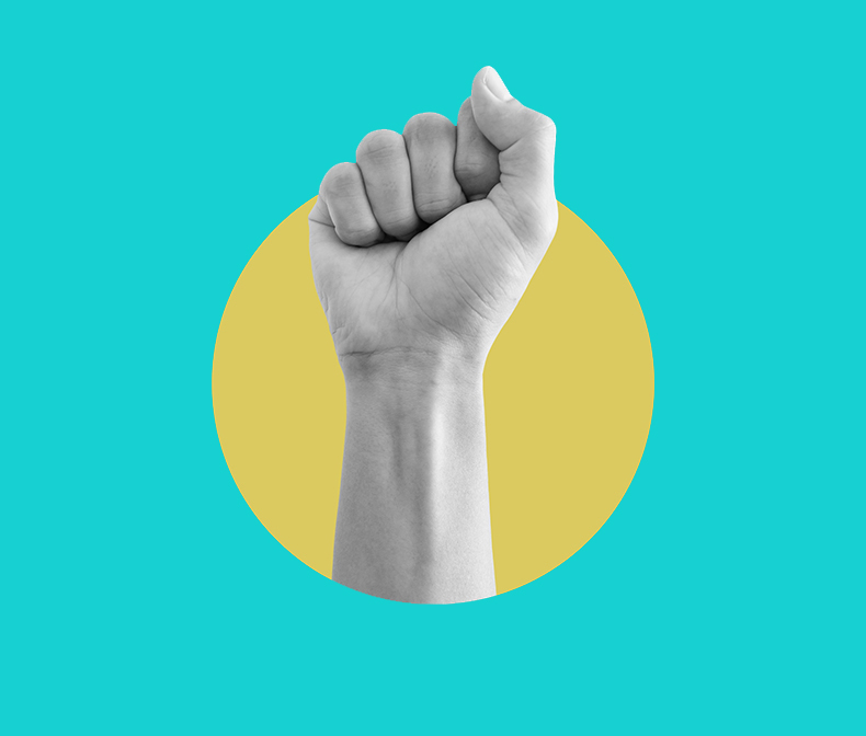 Hand raised in a fist in protest