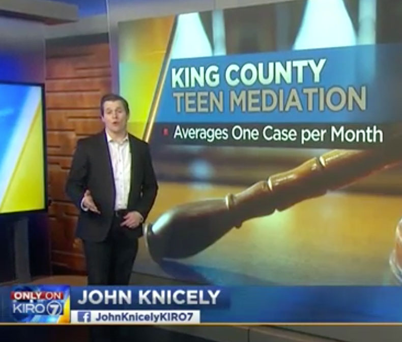 kiro7 newscaster in front of projection screen 