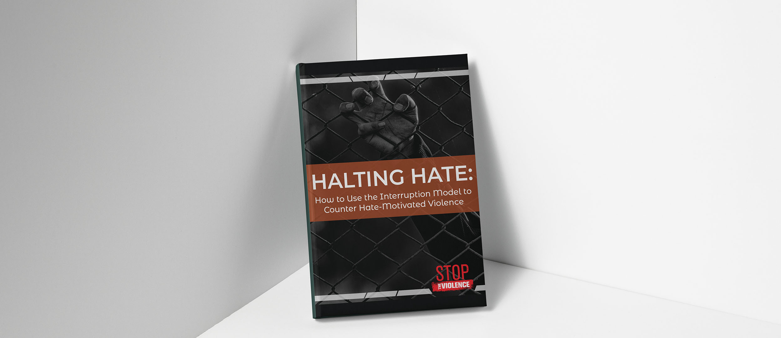Report cover with a fence and a hand Report cover with a fence and a hand